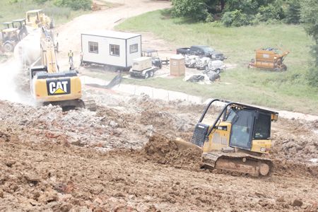 With rains holding off through the morning, workers have had additional time to continue efforts to protect and repair the levee in order to prevent a breach.